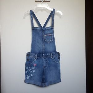Denim short overalls.